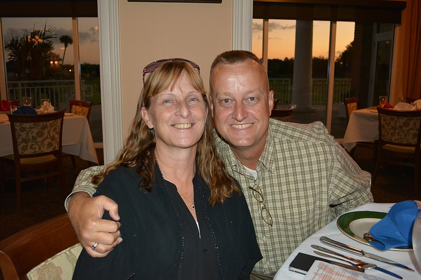 Mindi Lanford and her husband, retired Marine Kelly Lanford, enjoy a moment before Kelly addressed the crowd as the evening's guest speaker at the Veterans Day Dinner and Dance at the Tara Golf & Country Club.