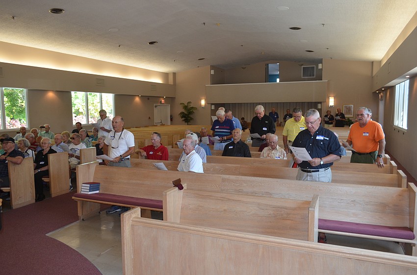Army veterans who served after 1956 sing the Army song.