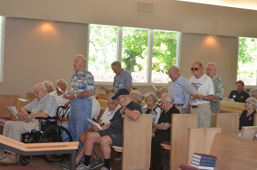 Navy veterans sing their song.