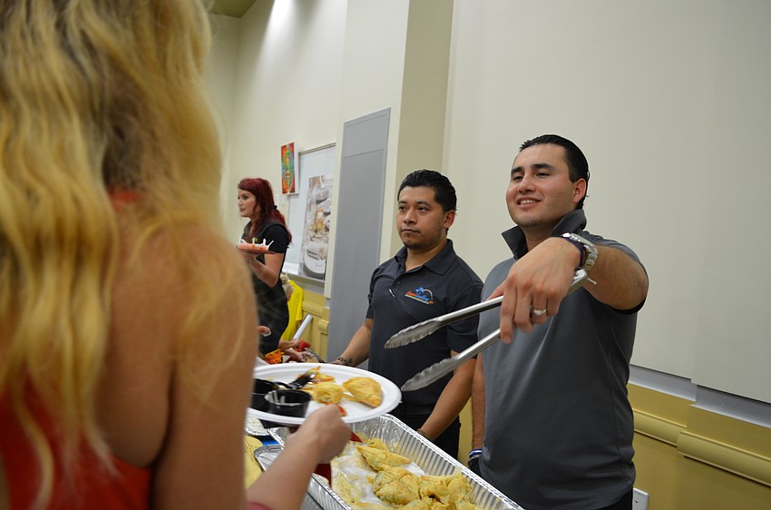 Arturo Perez from Dutch Valley serves up spinach pie.