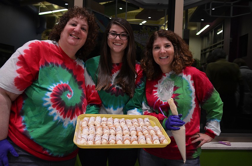 Laurie Moretti with Emily and Julie Steiner served up traditional cannoli from PaiSanO's.