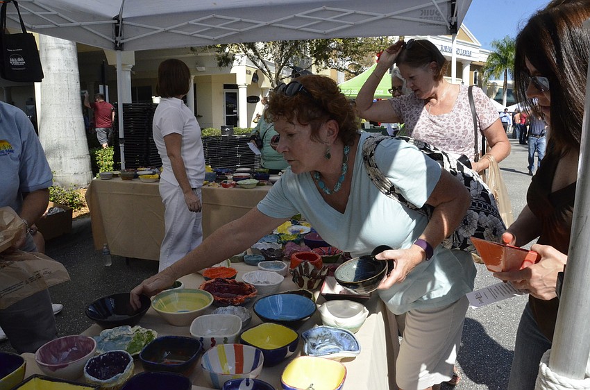Waterlefe resident Dyana Young examines the bowls to make a selection.