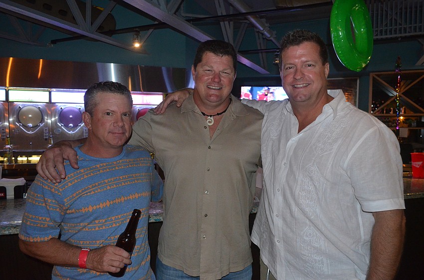 Adam Schwagler, Daiquiri Deck owner Troy Syprett and Chris Koeper