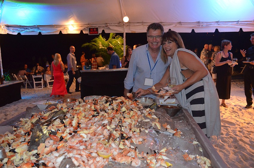 Wine consultant Robin Stephenson and Suzette Jones enjoy stone crab.