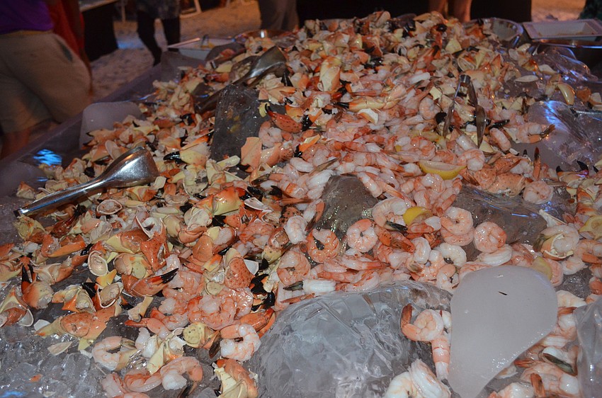 Guests enjoy the focal point of the evening: stone crab.