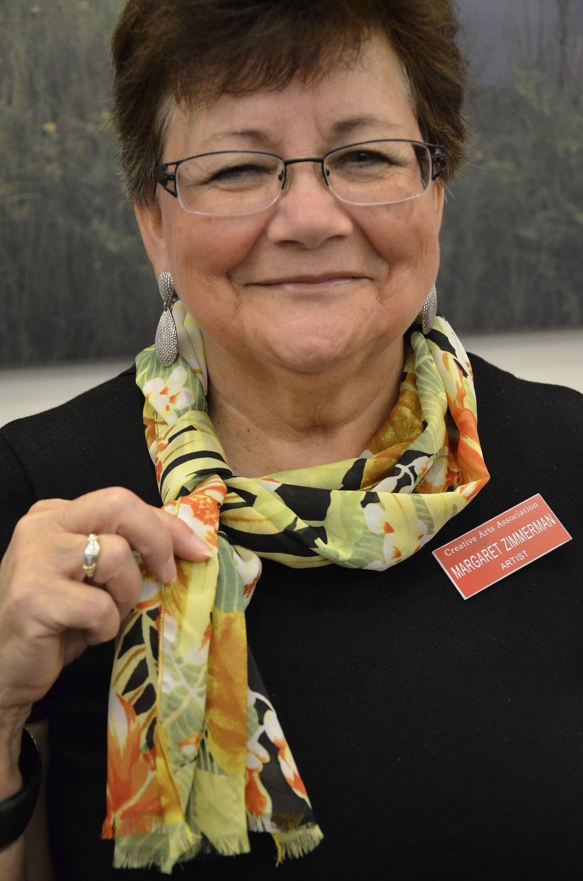 Margaret Zimmerman, a Watercrest resident, shows off her scarf with her business, The Classy Accent.