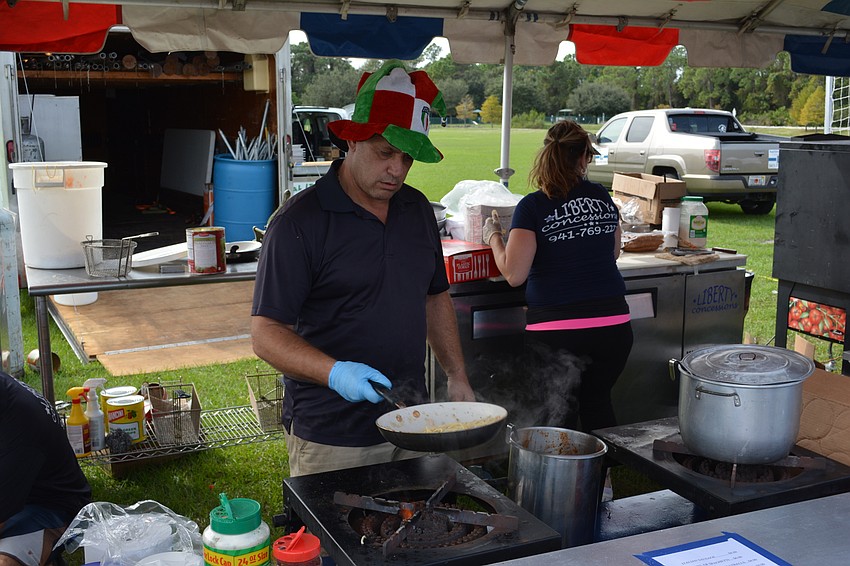 Michael Della Camera of Punta Gorda finishes an order of spaghetti with clam sauce during Festa Italiana on Saturday at Greenbrook.
