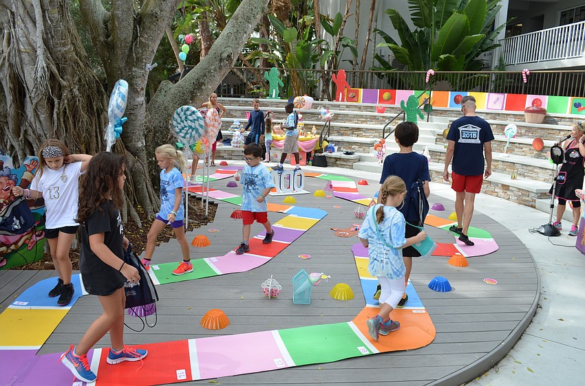 Students takes their chances during the cake walk.