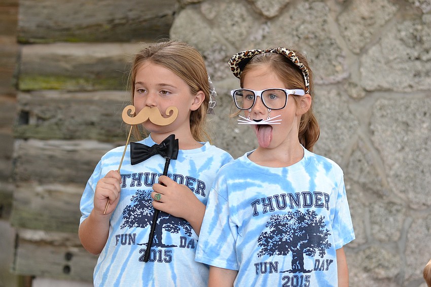 Alexa Gettel and Sami Fox make their silliest faces for a photo booth.