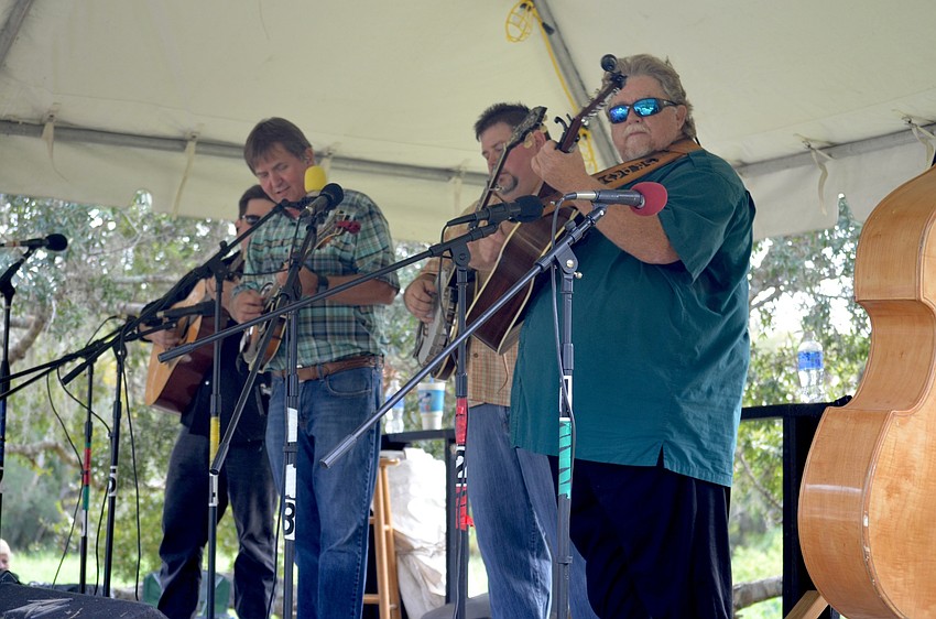 Highway 41 bluegrass band members Mark Horn, Donnie Harvey and J.R. Davis, of Bradenton, entertain their audience.