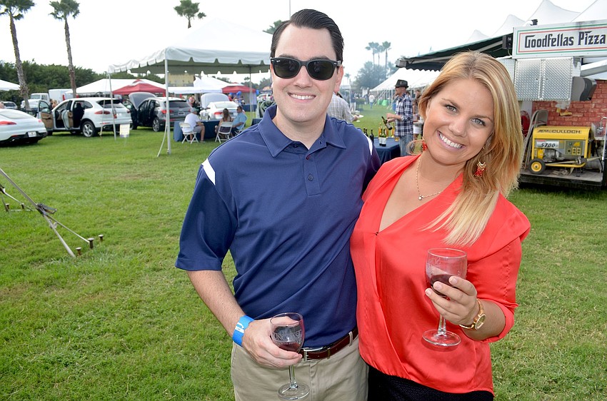 Ryan Adamchak and Lauren Earl, of Bradenton, enjoy red wine and time with friends.