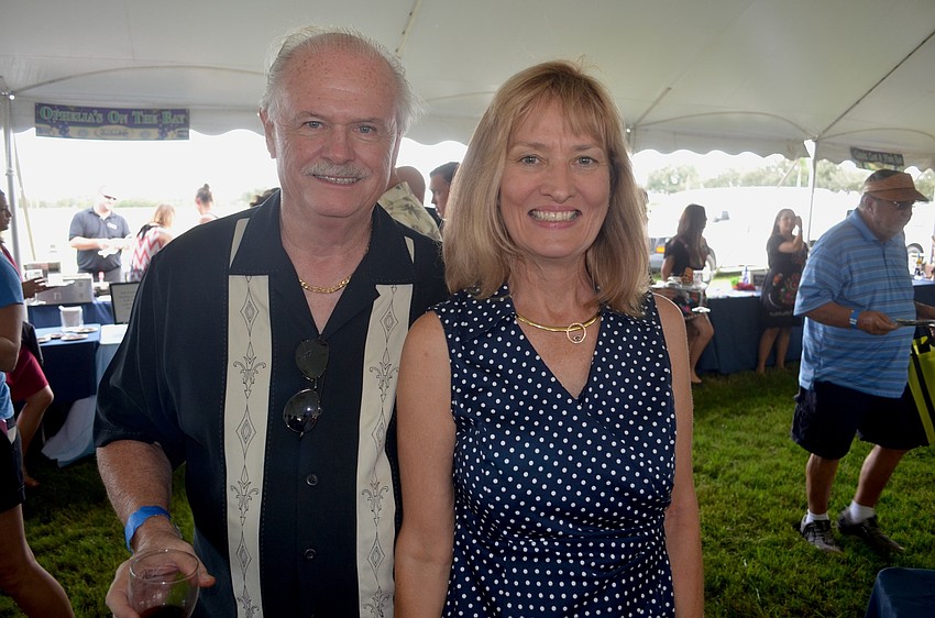 Tom and Marilyn LaConte, of University Place, search for their next food sample.