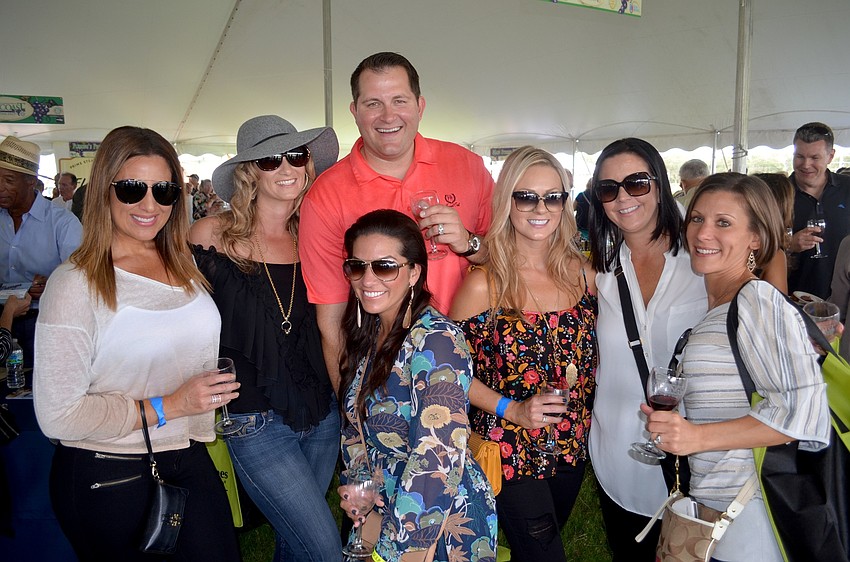 Friends Jessica Montalvo, Jennifer Groff, Dustin Meshberger, Jamie Chyorny, Lindsey Meshberger, Pam Minore and Marcella Marogi enjoy a range of wines.
