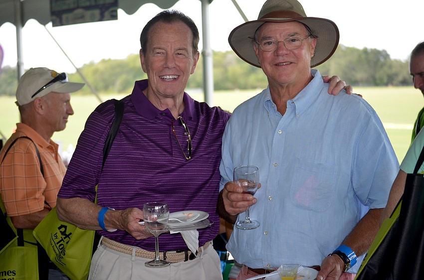 Snowbirds Dick Burtt, of Massachusetts, and Herb Sears, of New Hampshire, enjoy tasting different wines.
