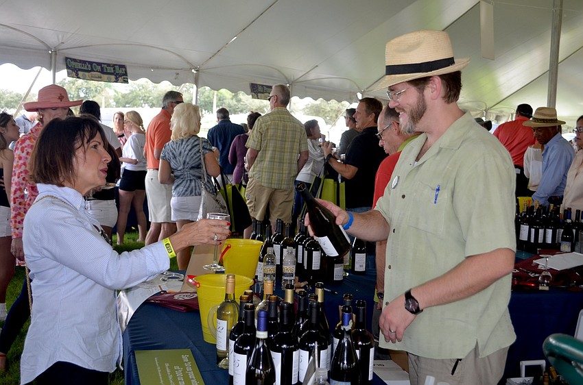 Cindy Loebel, of Tampa, and Adam McMullian, of Bradenton, talk about wine.