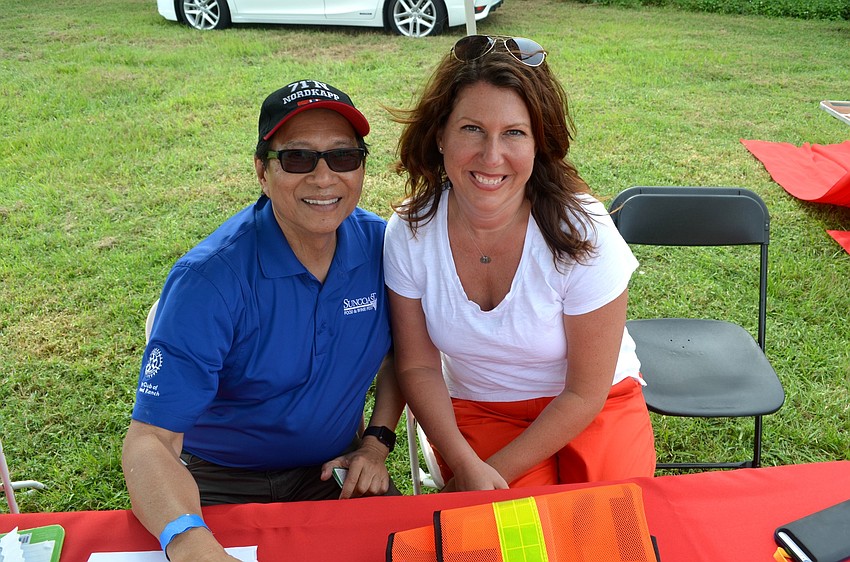 Rotary Club of Lakewood Ranch members Fred Lopez and  Denise Pope wait for attendees to arrive.