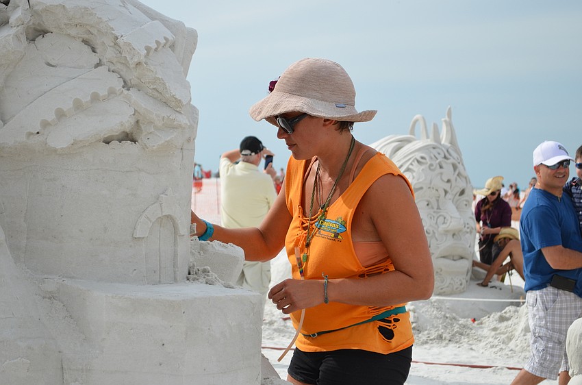 Morgan Rudluff works on the sculpture for plot 9.