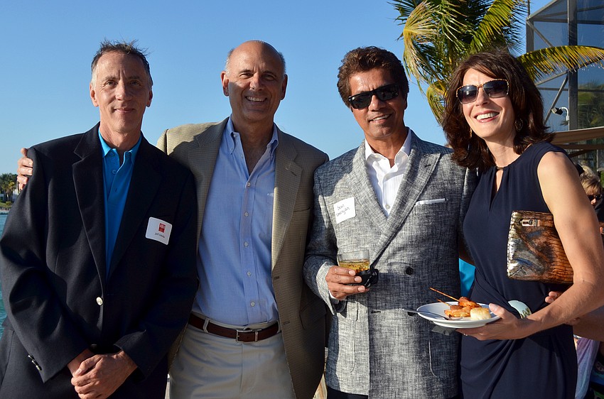 Jeff Sebeika and Charlie Huisking with Sean and Melanie Natarajan