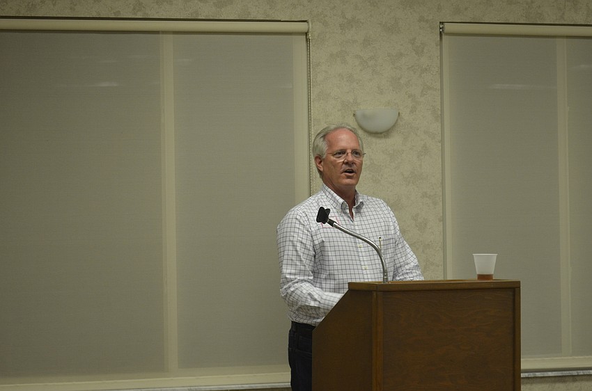 Michael Drake speaks.