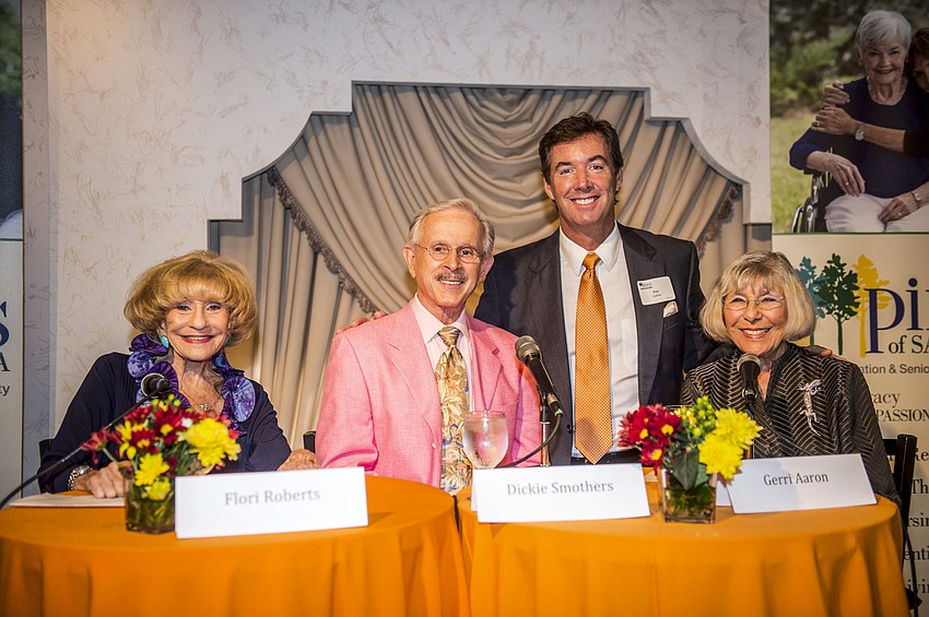 The panelists prepare to discuss the 