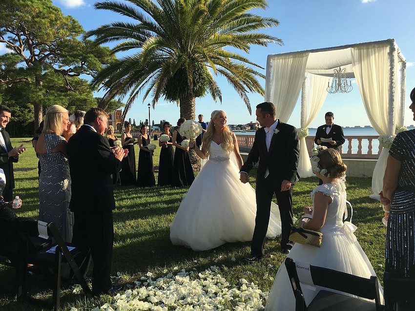 The couple was married under a custom-built canopy near the water on the New College lawn. (Photo Credit: Katie Beyer Photography)