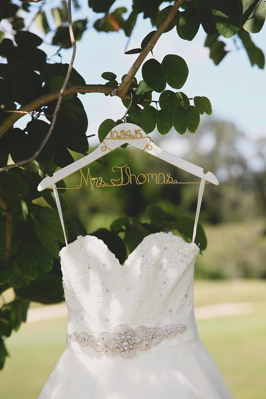 Ivory ball gown with lace top and custom crystal belt by Mori Lee. (Photo Credit: Katie Beyer Photography)
