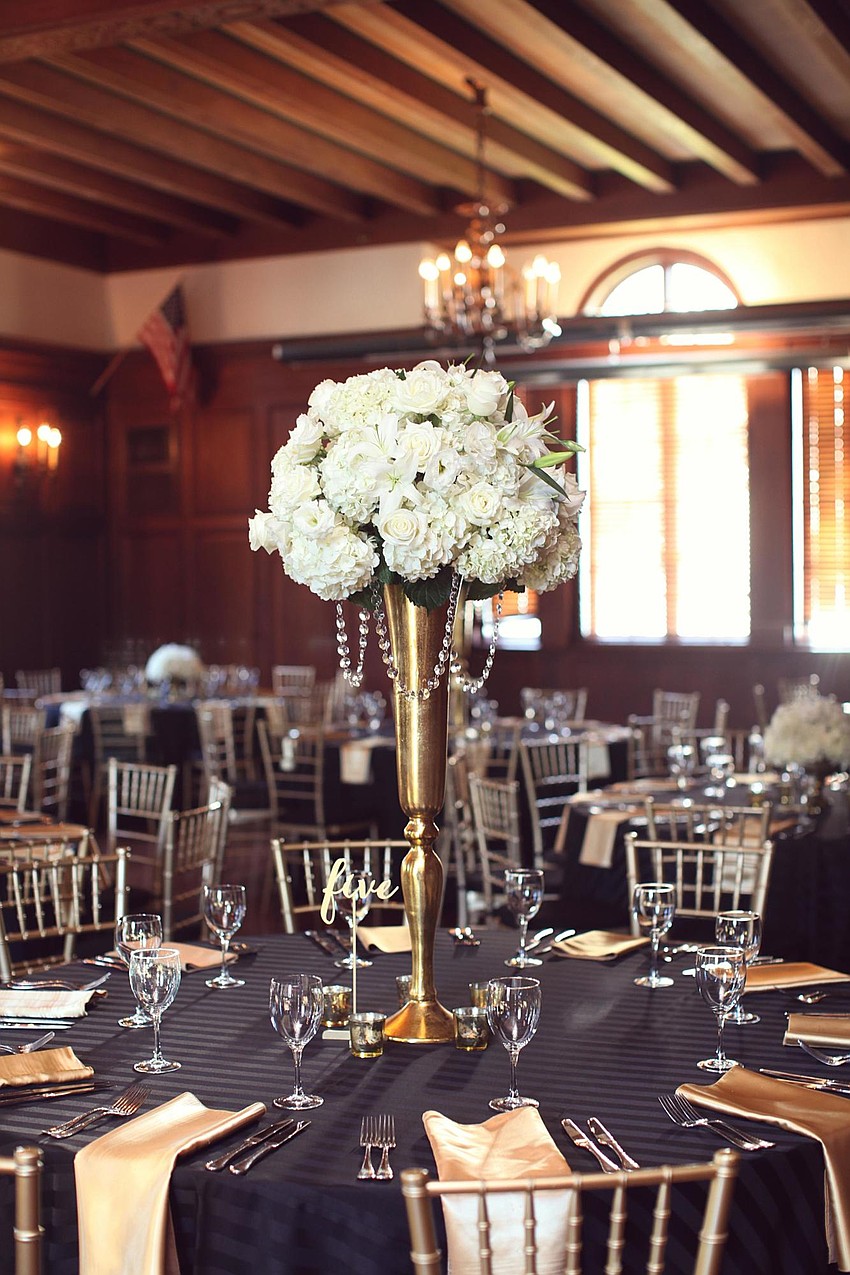 Floral designs were all-white flowers by Elegant Designs. (Photo Credit: Katie Beyer Photography)