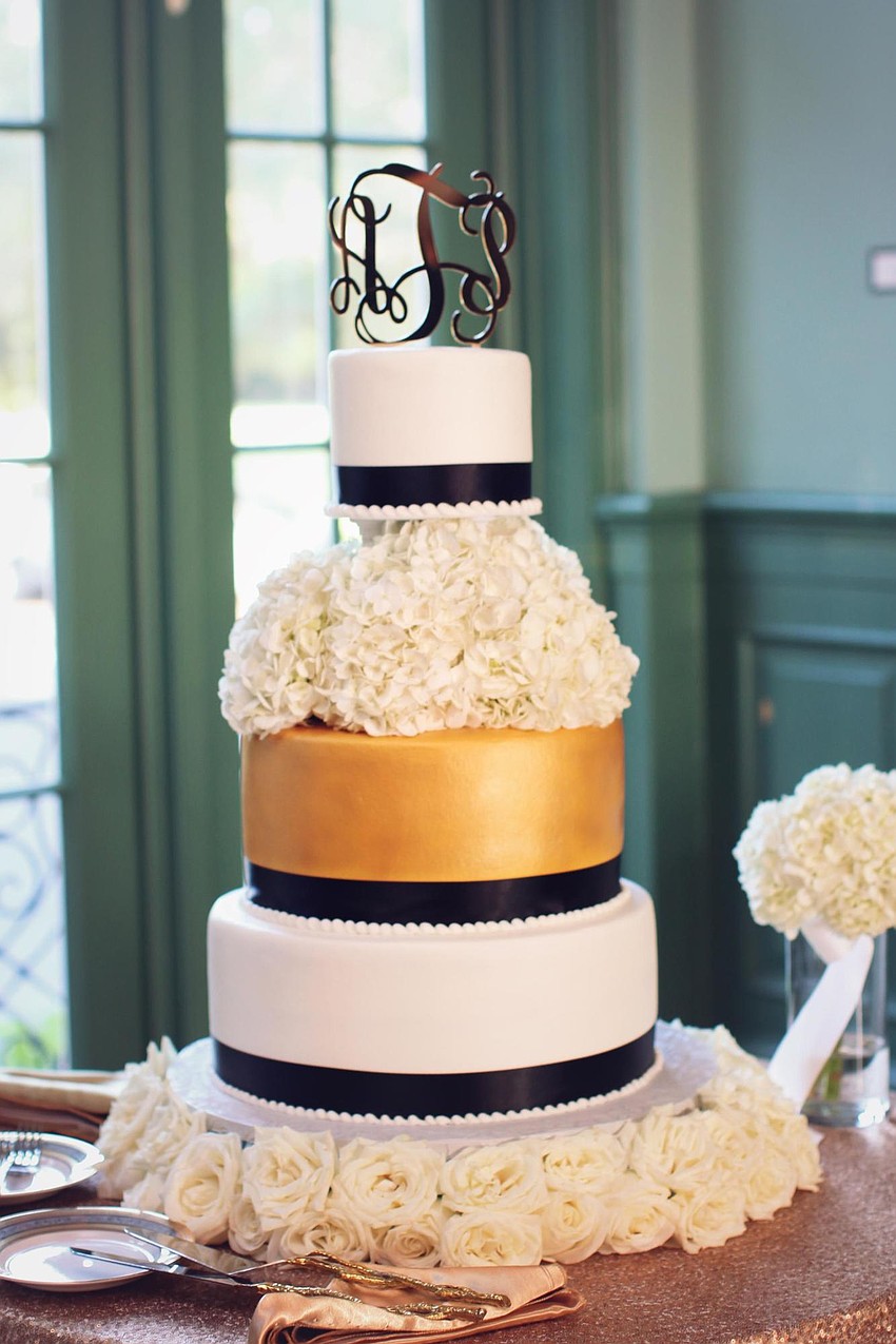 The cake was a three-tier white-and-gold cake, consisting of vanilla with white chocolate and chocolate with Oreo and carrot by Heavenly Cakes. (Photo Credit: Katie Beyer Photography)