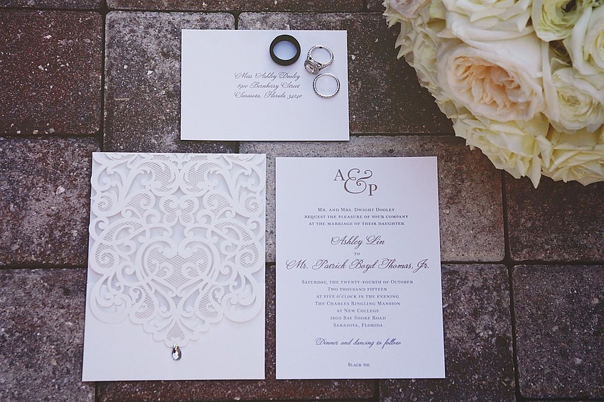 Invitations were ivory lace custom pocket cards with gold accents by Write-On Sarasota. (Photo Credit: Katie Beyer Photography)