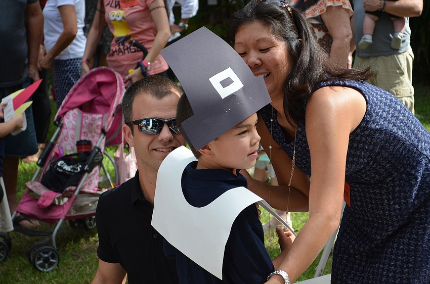 Andy and Kristina Harshman embrace their pilgrim actor Zack Harshman.