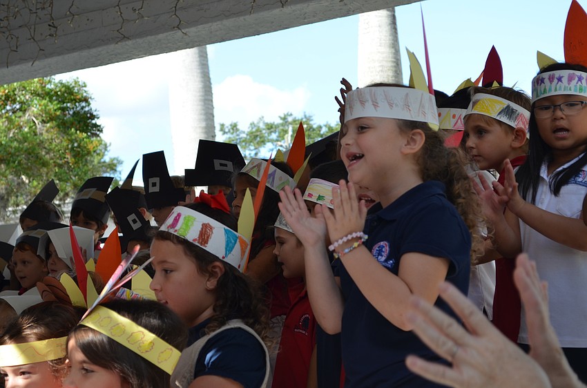 Students sing and clap along to 