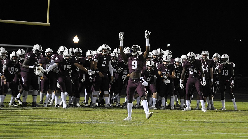 Braden River defensive back JoJo Louis leads the Pirates out onto the field.