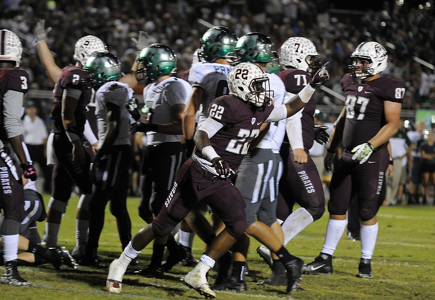 Braden River running back Dexter Hodo celebrates following his 8-yard touchdown to close out the first quarter.