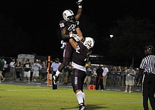 Braden River running back DeShaun Fenwick and offensive lineman Alex Salguero celebrate following Fenwick's touchdown run in the second quarter.
