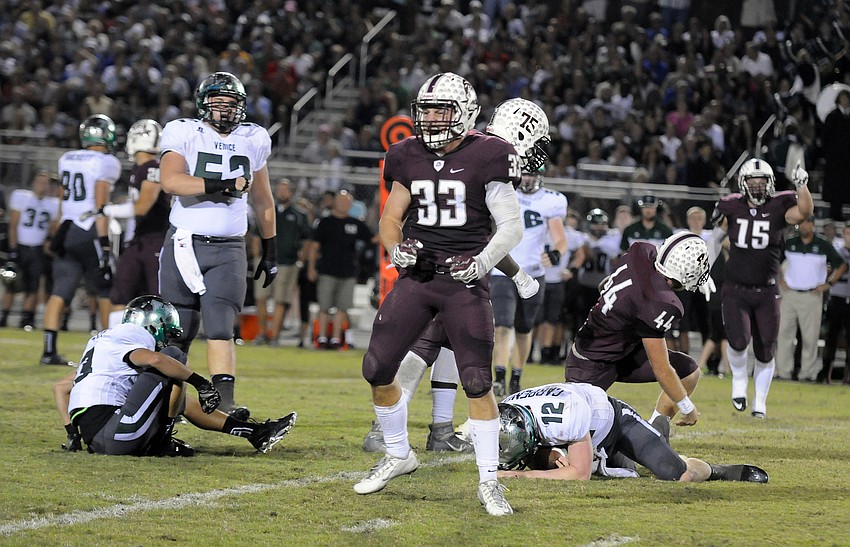 Braden River linebacker Ronnie McClellan celebrates after sacking Venice quarterback Bryce Carpenter.
