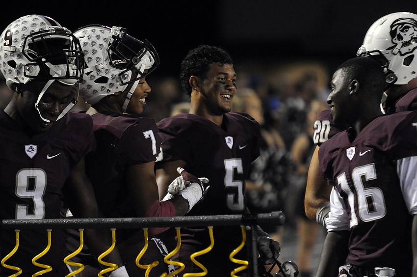 Braden River's JoJo Louis. Demetrius Lawson, Tyrone Collins and Terrell Thomas celebrate following Collins' second interception of the game.
