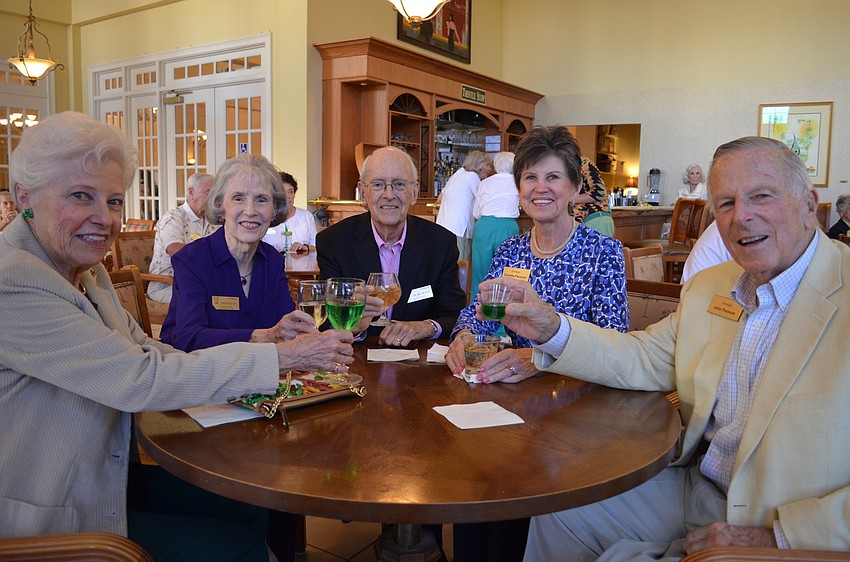 Sally Crowell, Marion Nelson, Phil Nelson, Carlotta and John Parsons toast to St. Patrick’s Day.