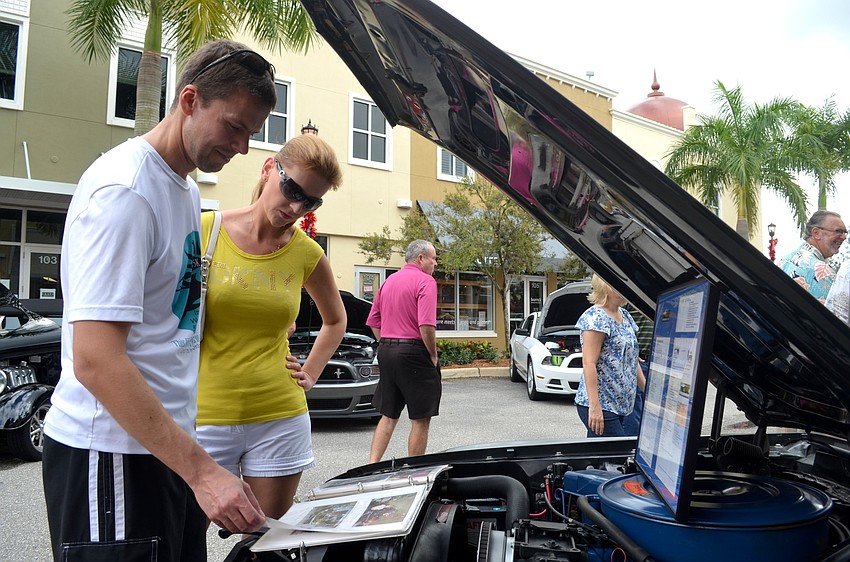 Chris and Wioletta Stypula, of Bradenton, learn about Mustang history.