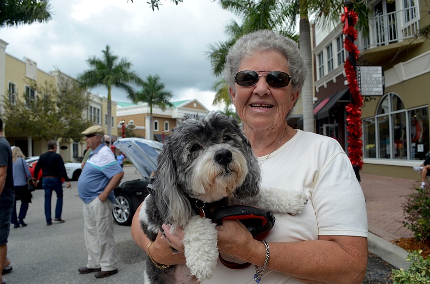 Bonita Russell, of Palmetto, and her furry friend, Zeus, enjoy an afternoon of cars.