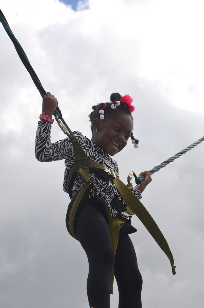 Journi Robinson, of Bradenton, jumps as high as she can.