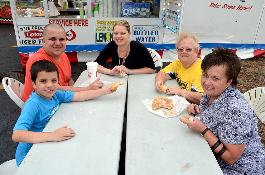 Sawyer, Justin and Amber Gray, of Bradenton, enjoy a snack with Jackie Long and Jeannine Gray.