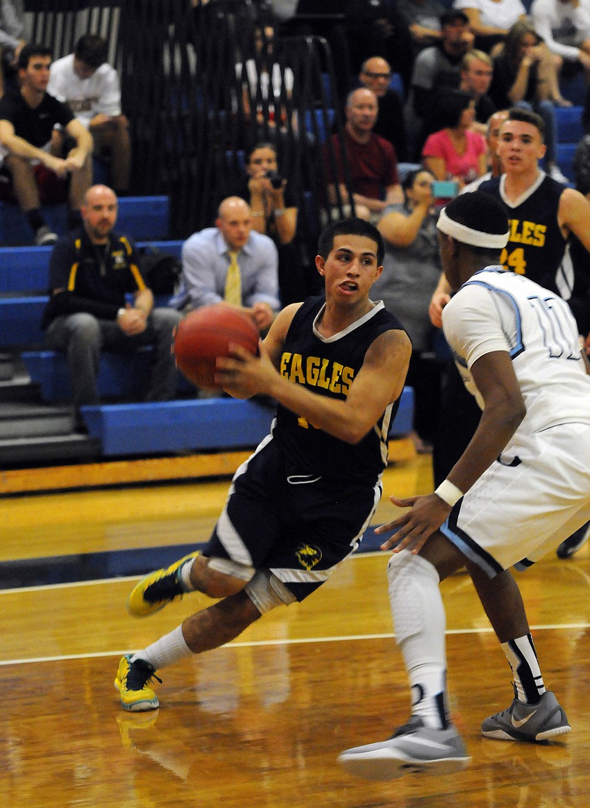 Sarasota Military Academy's Anthony Del Sole drives to the basket in the second quarter.