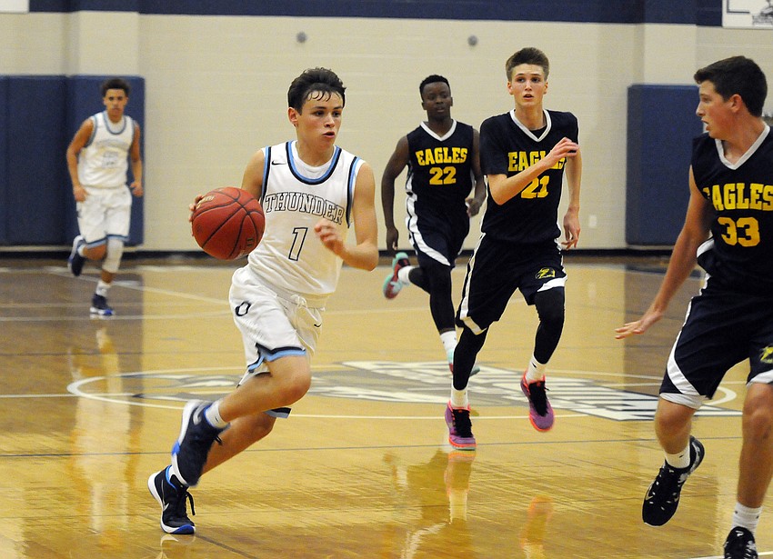 The Out-of-Door Academy sophomore Chase Maasdorp drives to the hoop during the Thunder's 66-48 victory versus Sarasota Military Academy Nov. 16.