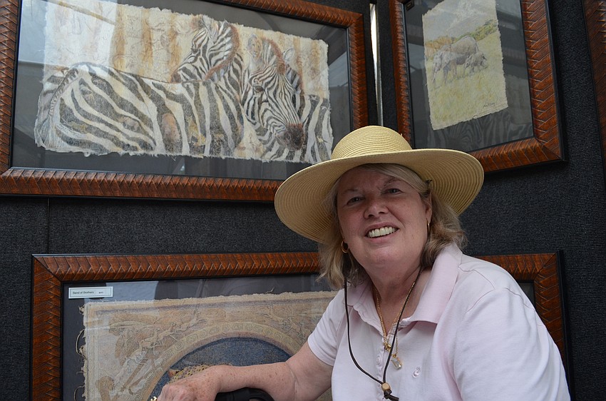Nancy H. Straily with her wildlife portraits.