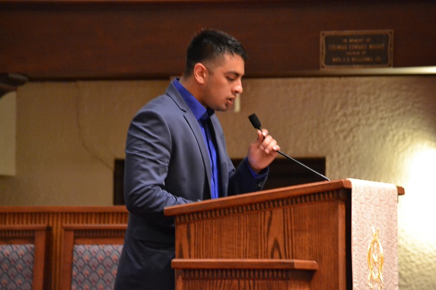 Yusuf Memon performs the call to prayer in Arabic before translating it to English.