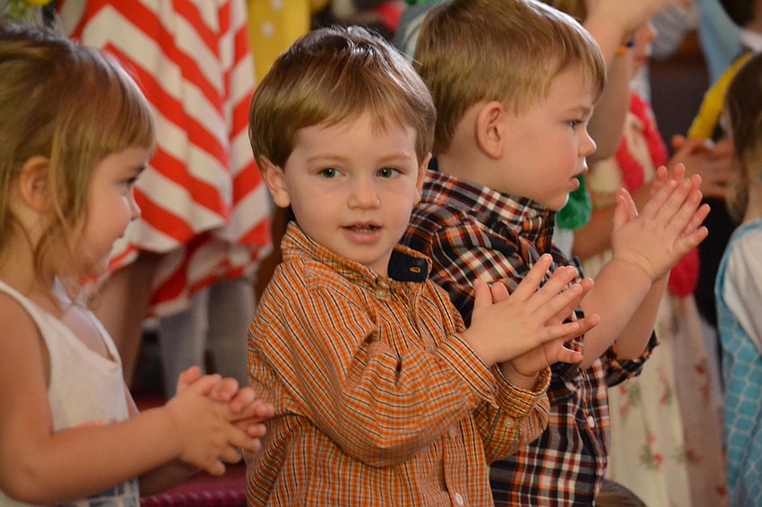 Garrett Barcell claps along with the music.
