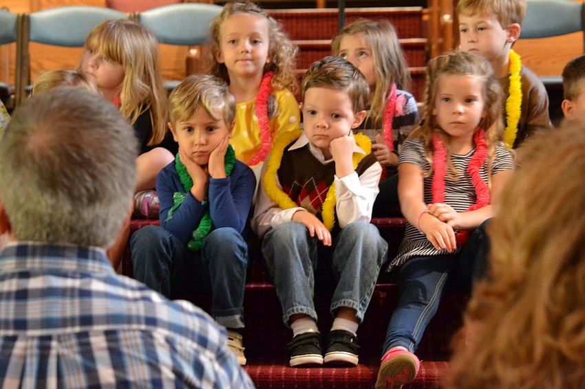 James Harrington, Tate Powell and Harper Hollingsworth listen closely to Rev. Glen Bell explain the meaning of Thanksgiving.