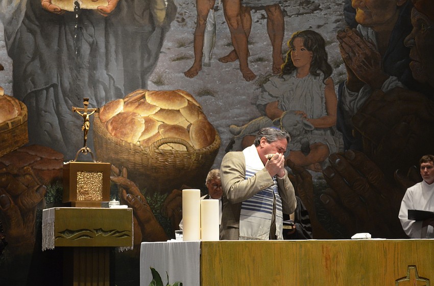 Rabbi Jonathan Katz, of Temple Beth Israel, sounds the shofar.
