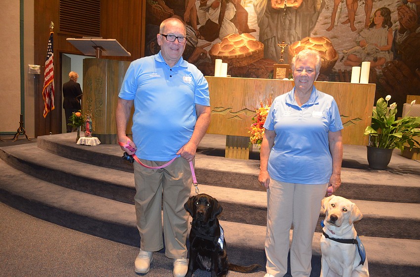 Ron and Joyce Landbeck, with Sandy and Julie, Southeastern Guide Dogs in training