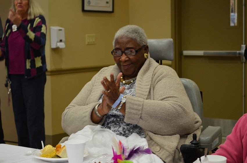 Adele Wiggins claps with delight at the poem that the children recited to residents.